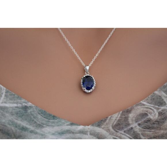 Sterling Silver Blue Oval CZ Pendant Circled in Clear CZ Stones Necklace - Picture 5 of 5